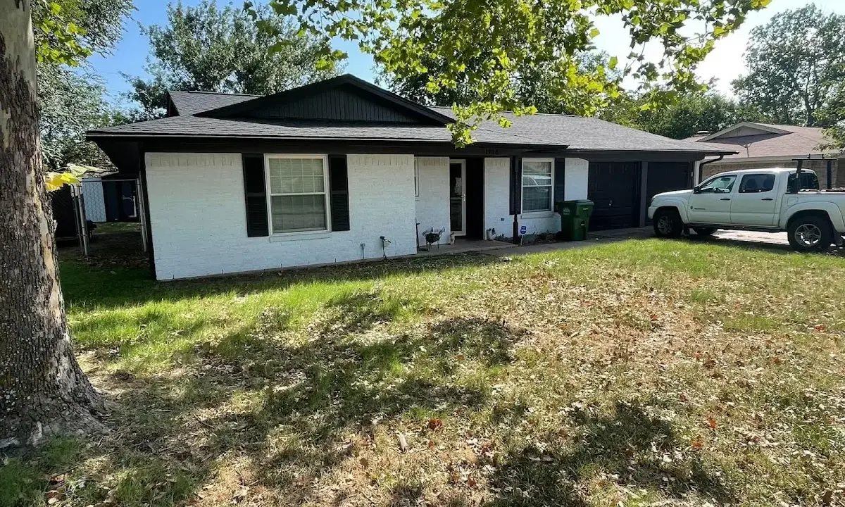 Professional roofing crew working on a residential roof in Texas City